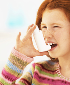Chiropractic care may help reduce the frequency and severity of asthma attacks. Child with asthma and inhaler
