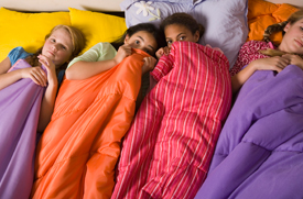 Lack of bladder control can cause shame and impair social skills. Girls having a sleep over